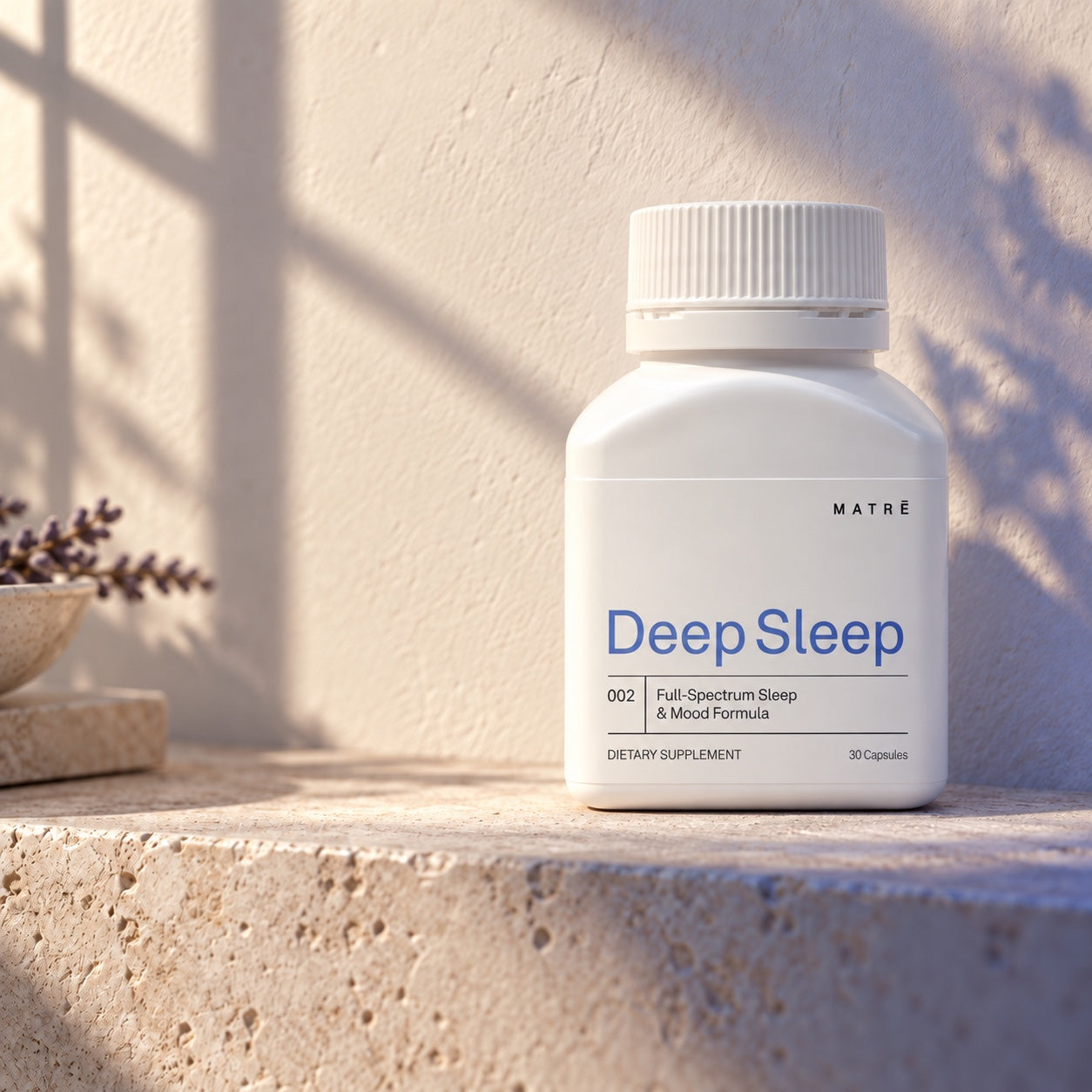 Matrē Deep Sleep, 30 capsules, on pale stone in soft natural light