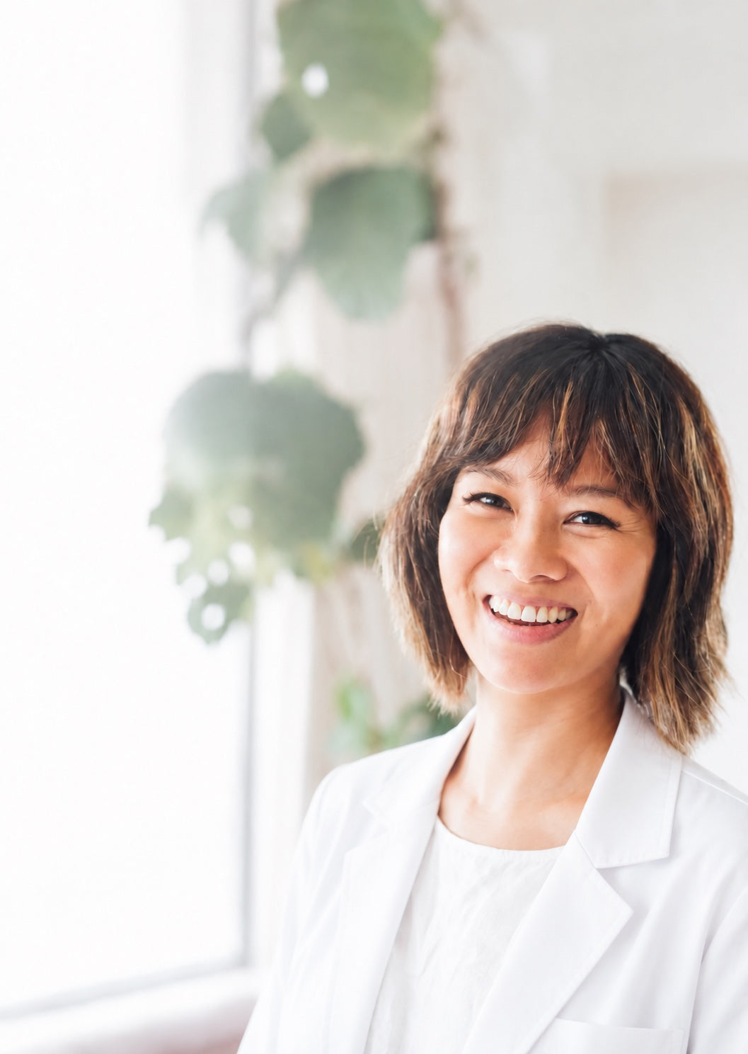 Dr Cheryl Kam wearing a white doctor's coat